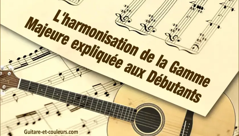 Une guitare repose sur des partitions de musique. Le texte "L'harmonisation de la Gamme Majeure expliquée aux Débutants" est visible.