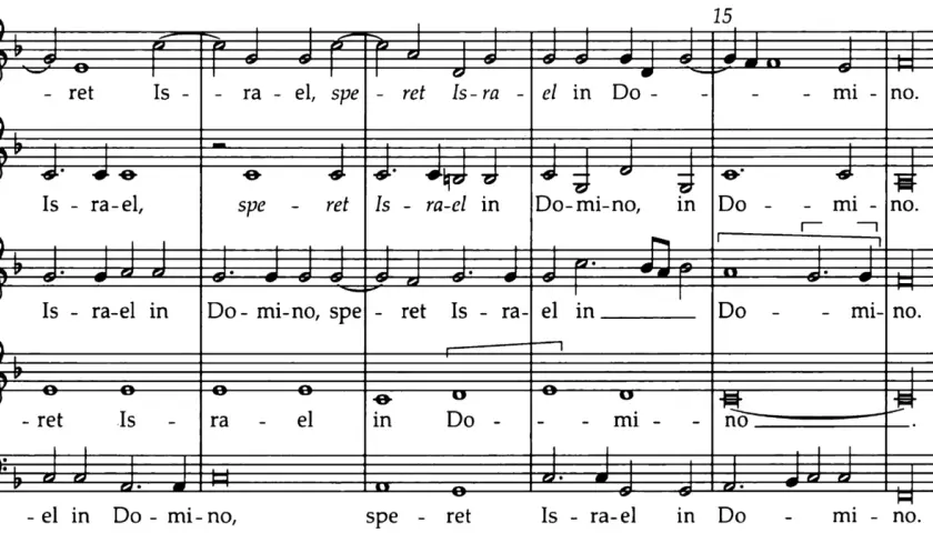 Extrait de partition musicale montrant un exemple de polyphonie vocale avec les paroles "Israel in Domino".