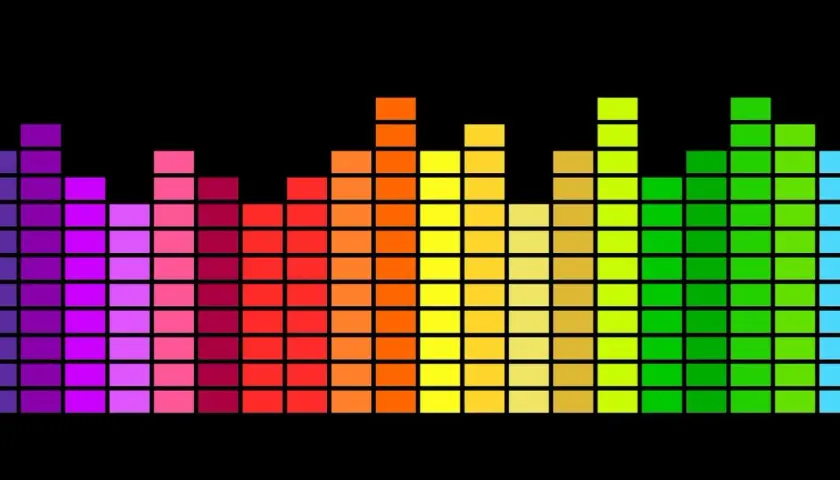 Un **égaliseur musique** arc-en-ciel sur fond noir, avec des barres de différentes hauteurs représentant les fréquences sonores.